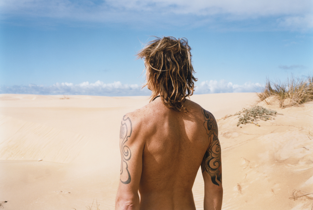 Man Standing On Beach