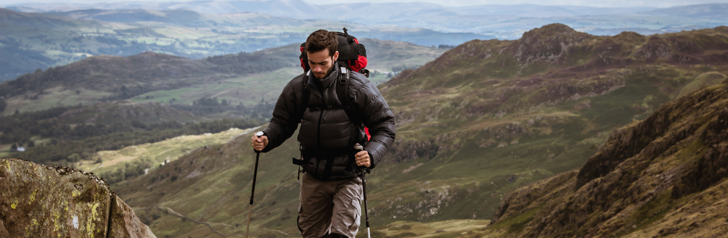 Young Male Hiker Moving Up Mountain, The Lake District, Cumbria, Uk