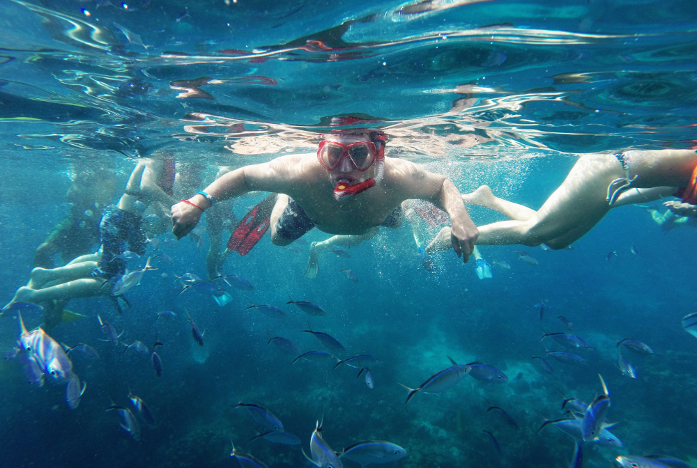 Friends Swimming In Sea