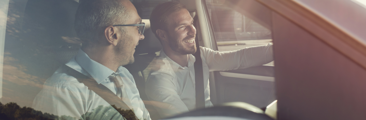 Happy Business Colleagues Going On A Trip By Car.