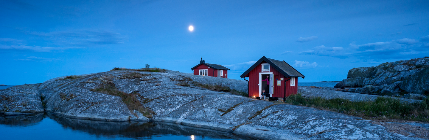 Wooden House On Rocky Coast