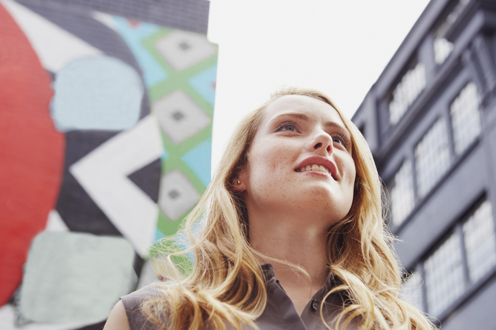 Women Smiling, Wall Art In Background, London, Uk