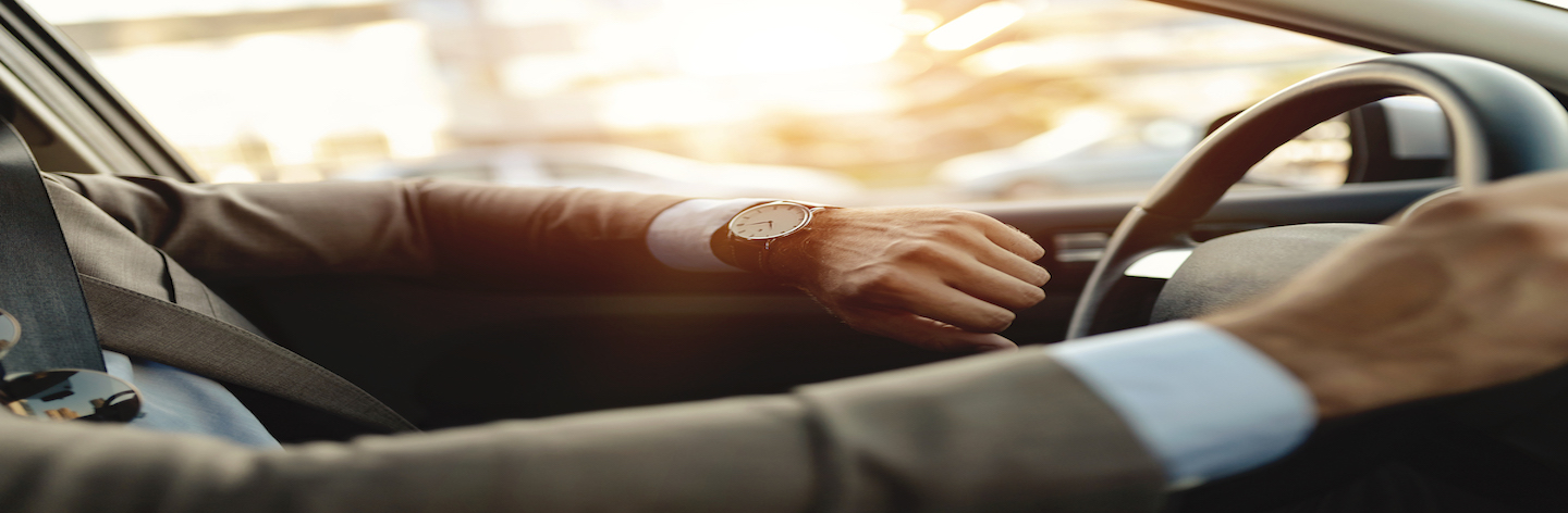 Businessman Is Looking At Watch In His Car