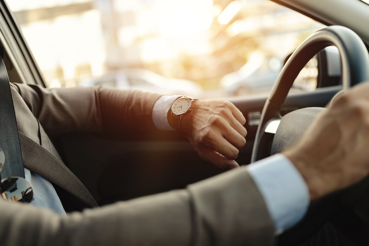 Businessman Is Looking At Watch In His Car
