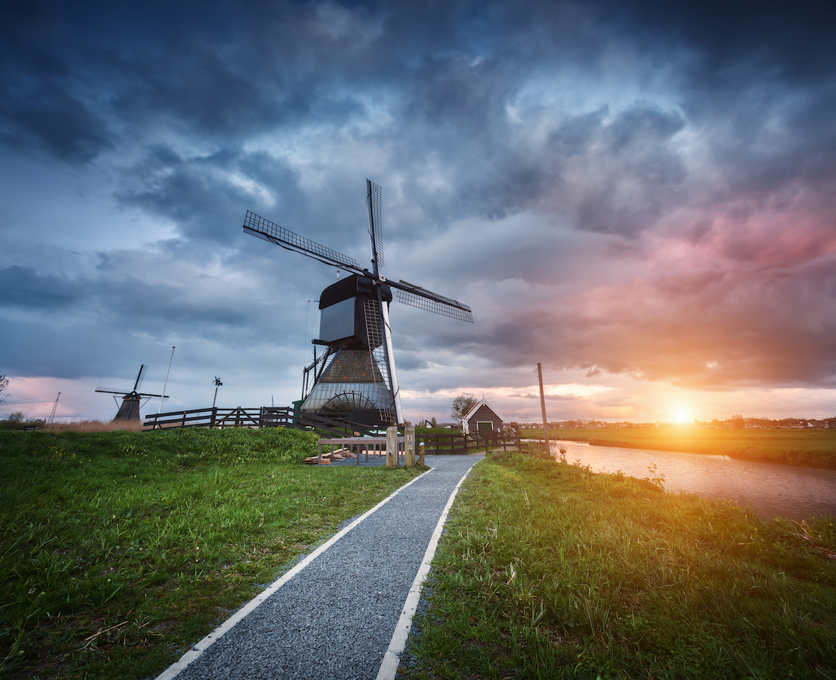 http://Landscape%20With%20Traditional%20Dutch%20Windmills%20At%20Sunset