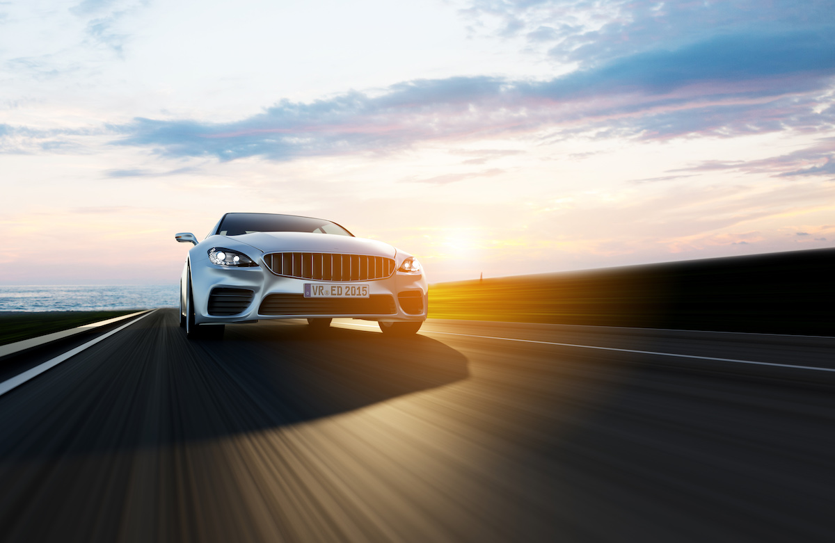 Car Driving On A Road By Sea