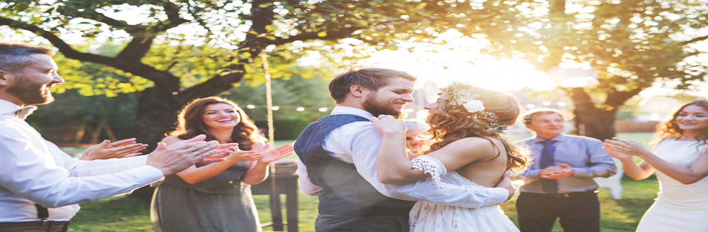 Bride And Groom Dancing At Wedding Reception Outside In The Backyard.